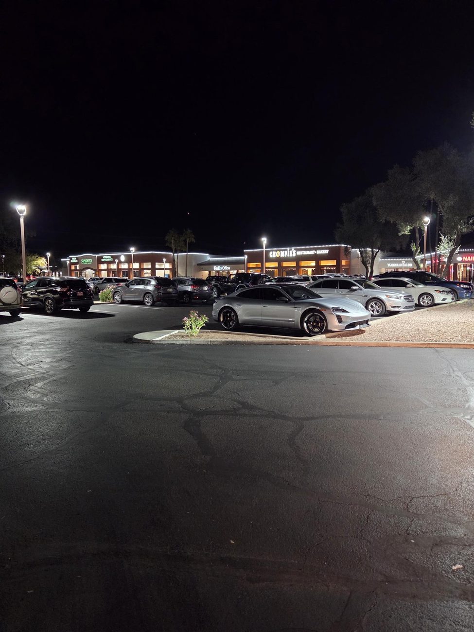 A wide Arizona shopping plaza outlined in C9 LED roofline lights.