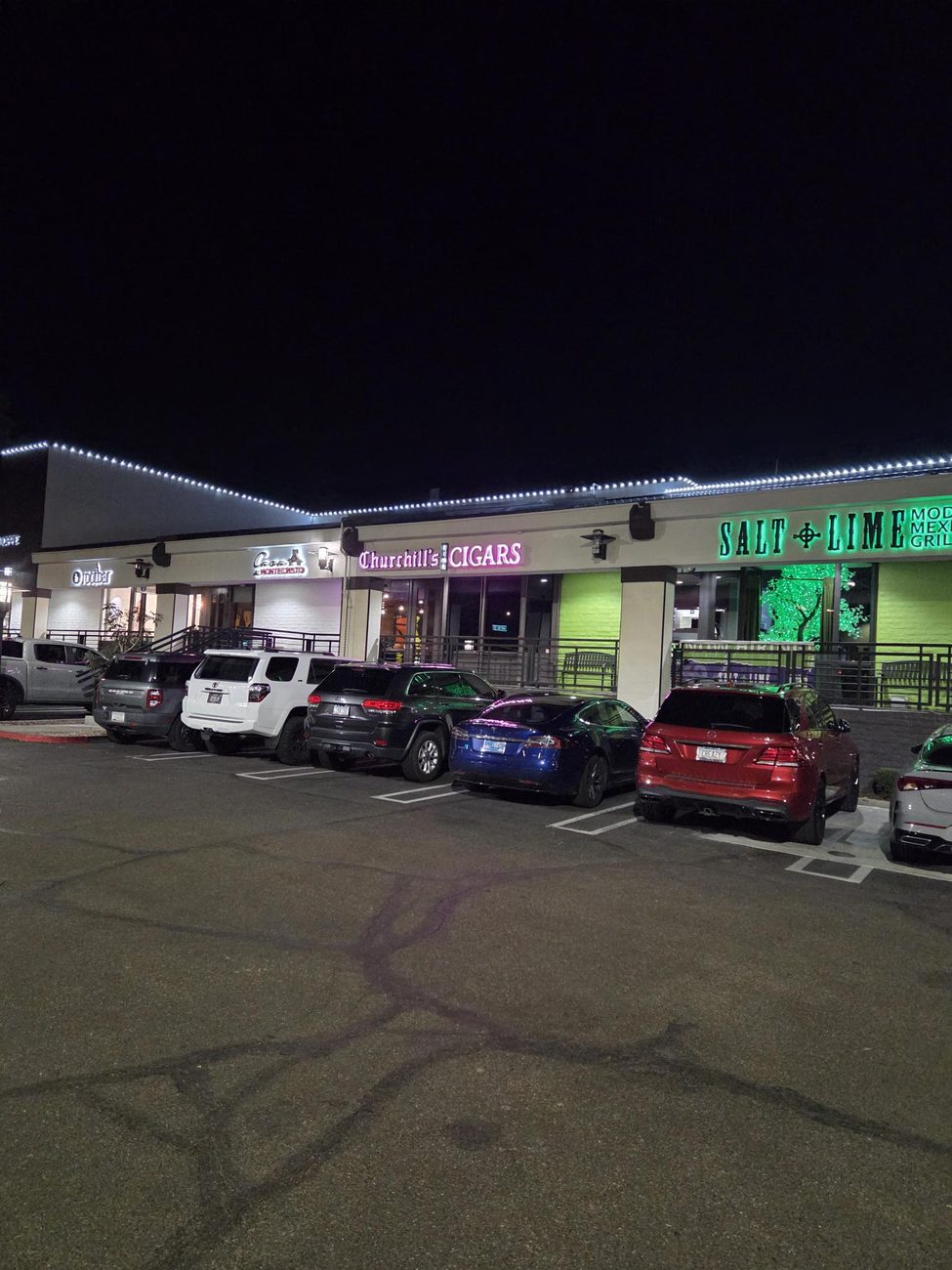An upscale dining and retail strip with clean C9 LED rooflines.